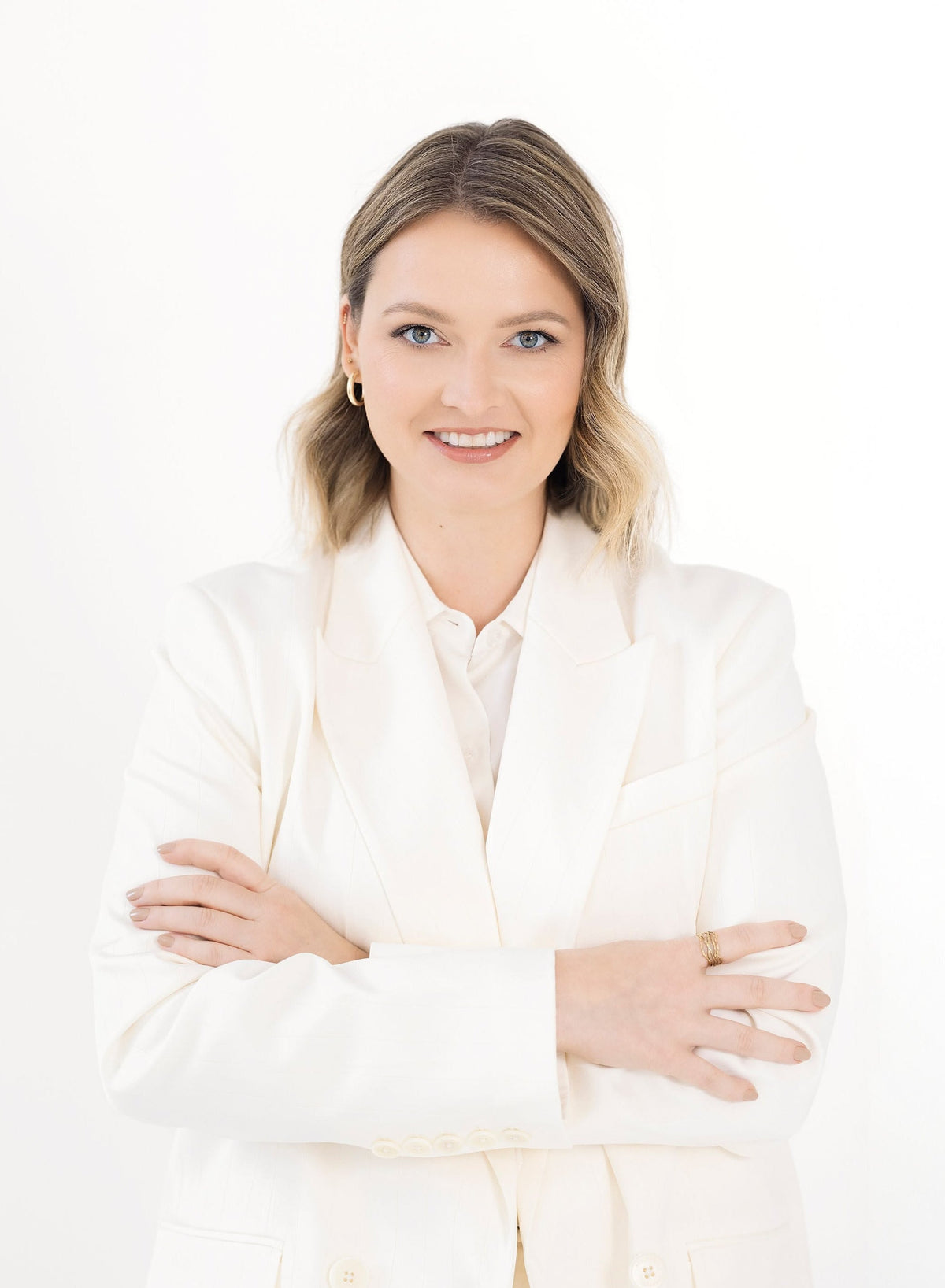 Adela Finerty, founder of Everyone's Republic, wearing a white blazer against a white background